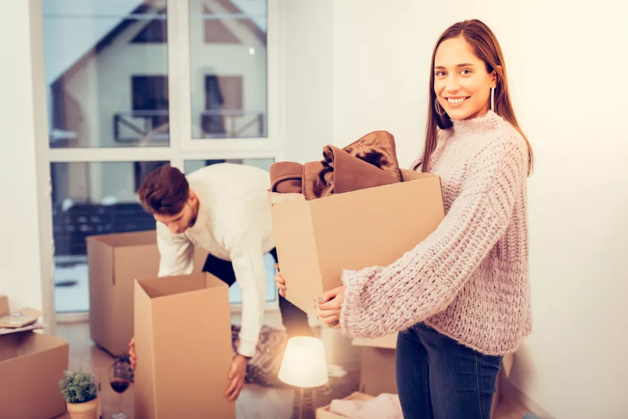 Couple moving into their new home, fall/winter season.