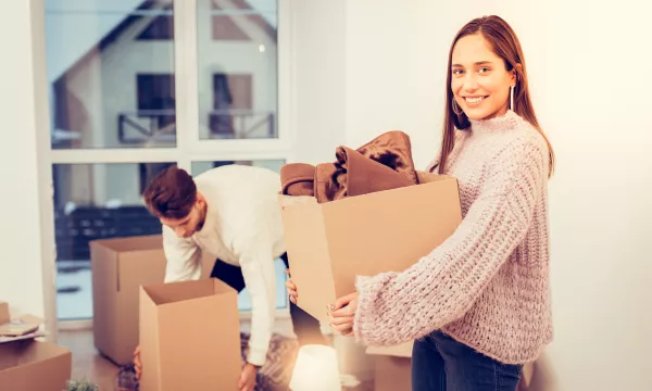 Couple moving into their new home, fall/winter season.