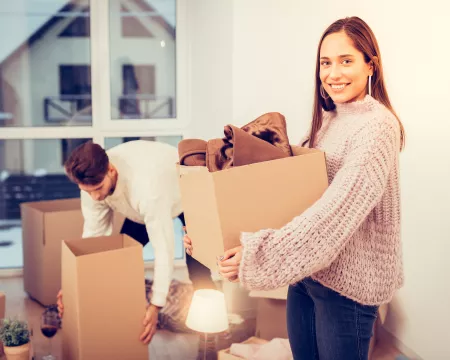 Couple moving into their new home, fall/winter season.